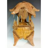 An unusual "sea shore" table lamp the body a coconut husk with serrated leaves,