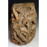 A 15th Century carved oak fragment or ceiling boss finely carved with leafage, 54cm x 32cm,