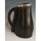 A silver mounted brown leather jack, the sturdy body and handle with thick stitching,