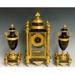 A mid 19th Century French three piece ormolu and bronze clock garniture decorated in the aesthetic