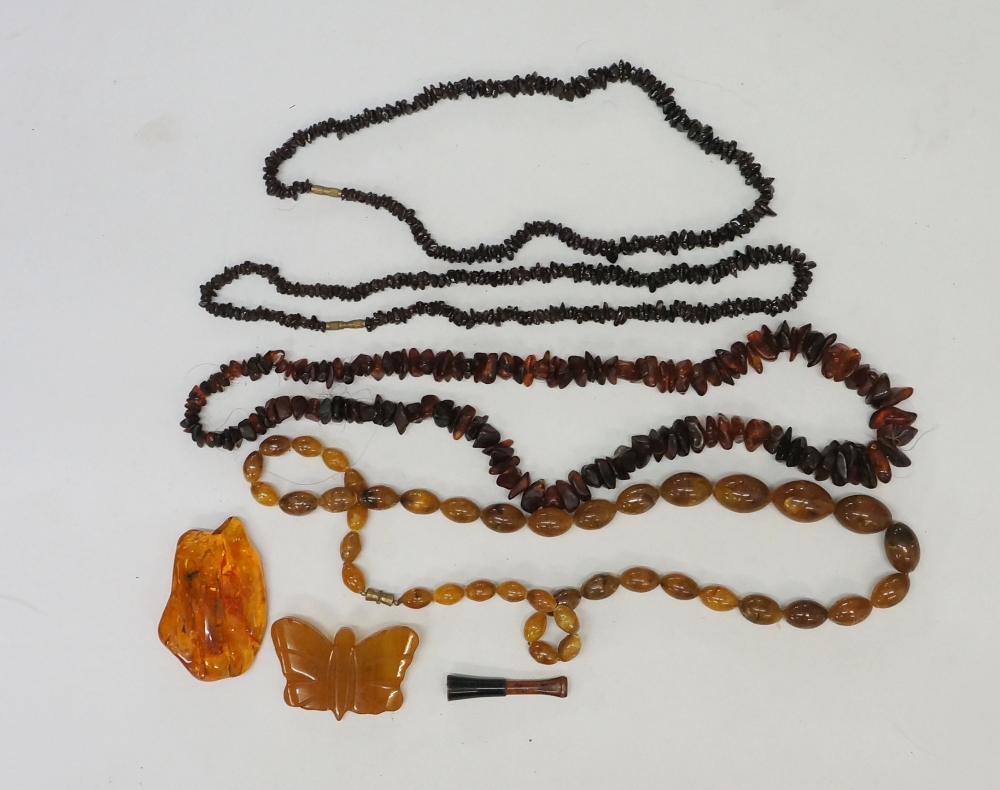 A bag of vintage and modern faux amber jewellery to include necklaces,