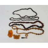 A bag of vintage and modern faux amber jewellery to include necklaces,