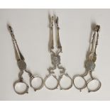 A collection of three George II and George III sets of sugar tongs,