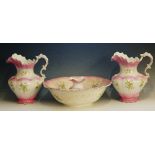 A Victorian pottery wash set, transfer printed and painted with ivy within pink borders,