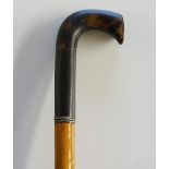 A 19th Century walking stick, the short L shaped handle carved of seamed tortoiseshell,