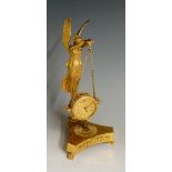 A 19th Century French ormolu mantel clock the winged angel figure holding chains supporting a drum