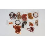A bag of vintage and modern faux amber jewellery to include: variously styled plastic necklaces,
