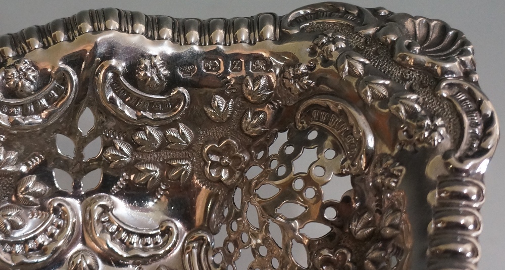 An oval sweetmeat dish, the body pierced, chased and embossed with scrolls and flowering foliage, - Image 2 of 2