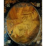 A Regency silk work picture the oval panel finely worked with a seated female with a lion at her