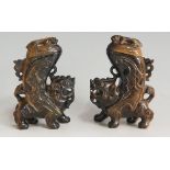 A pair of Tiger's eye lidded vessels carved as lidded libation cups on the backs of dogs of fo,