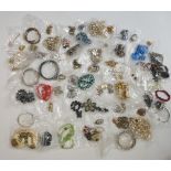 A bag of vintage and modern costume jewellery to include: variously multi-coloured plastic,