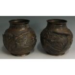 A pair of Japanese bronze vases of bellied form,