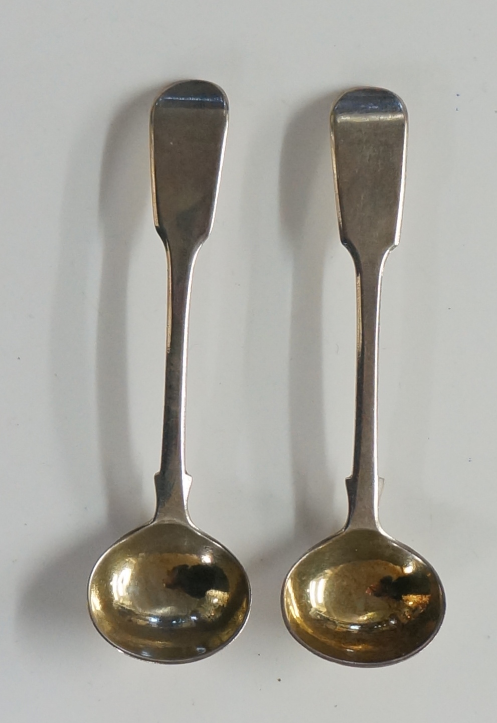 A pair of William IV fiddle pattern mustard spoons with gilded bowls, by Mary Chawner, London 1836,