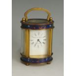 A brass and champlevé enamel cased carriage clock,