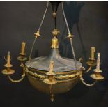 An Empire style gilt brass and black tôle ware six branch chandelier,
