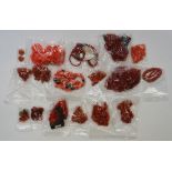 A bag of red coral jewellery,