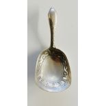 A George III silver caddy spoon,