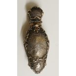 A fine 19th Century silver and gold scent bottle the cartouche shaped body finely engraved to the