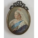 An oval lithographic portrait miniature of Queen Victoria contained within a ribbon tied oval brass