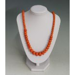 A set of graduated pink coral beads, 40cm long, beads 0.4cm - 1.