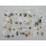 A bag of vintage and modern earrings, both clip on and for pierced ears, to include plastic,