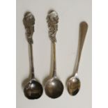 A selection of three spoons to include: a pair of mustard spoons with scrolling foliate terminals,