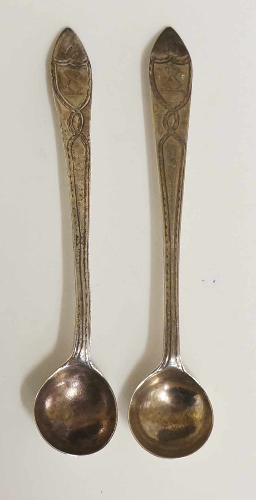 A pair of Irish silver mustard spoons, ribbon detailing to stems,