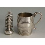 A miniature silver barrel shaped mug with serpent handle,