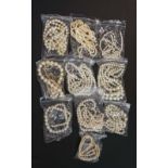 A bag of vintage and modern simulated pearl necklaces of various styles (qty)