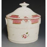 An English porcelain sucrier and cover decorated with pink hatched panels linked by floral headed