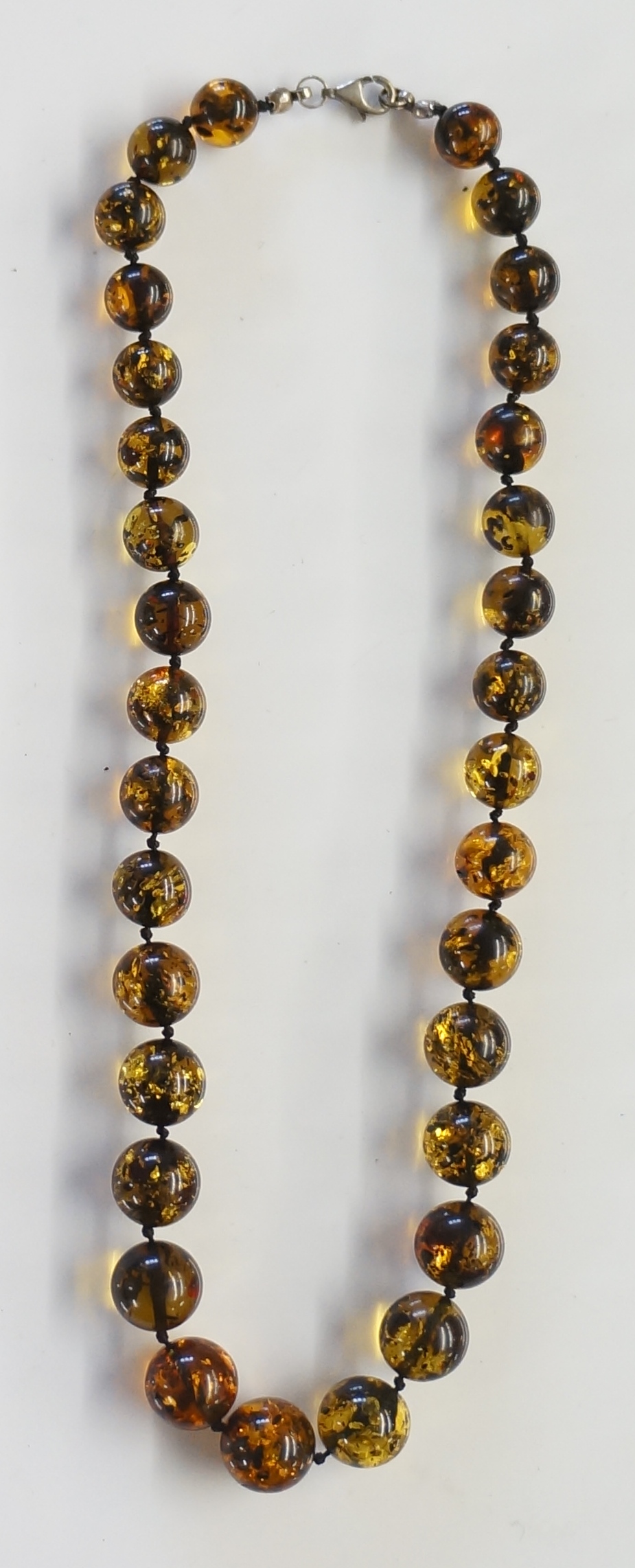 A set of green amber ? beads