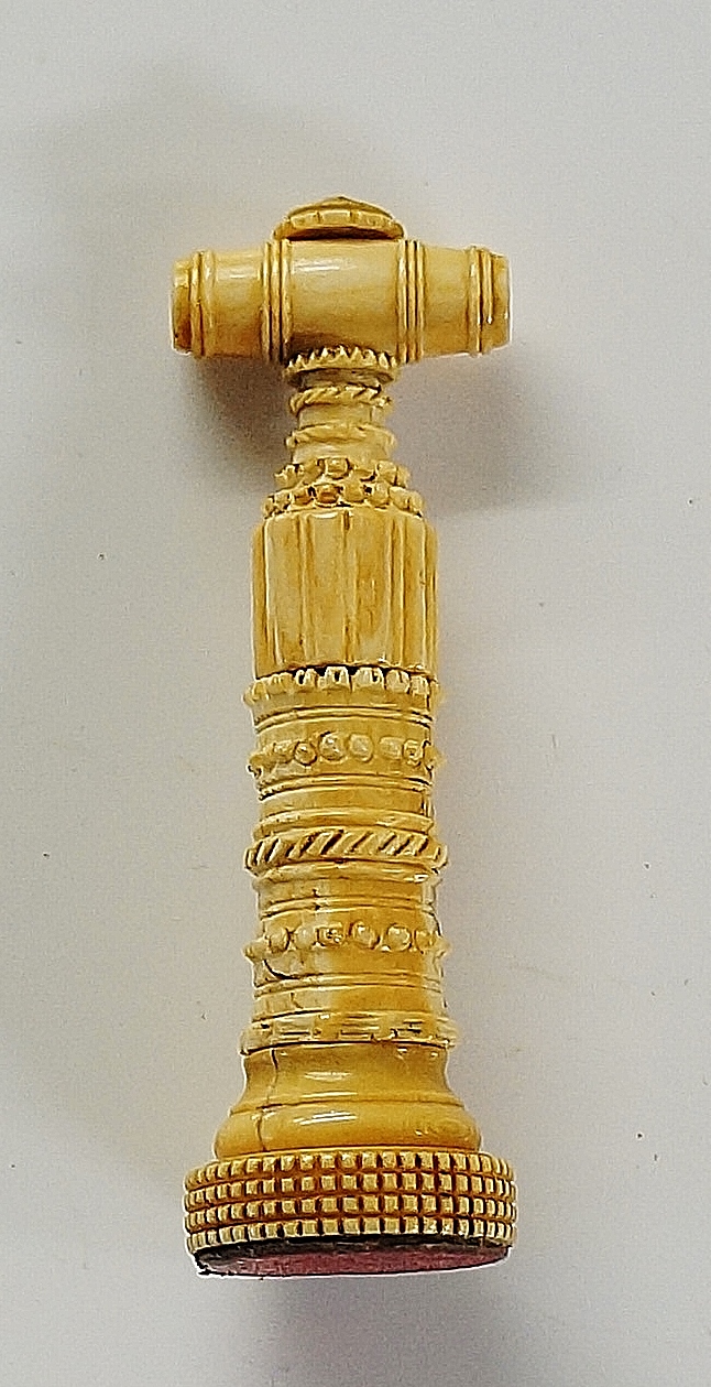 A miniature ivory perfume corkscrew, car