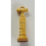 A miniature ivory perfume corkscrew, car