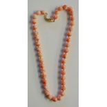 A pink angel coral necklace with silver gilt clasp marked 925