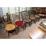 A set of four rail back kitchen chairs,