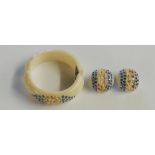 A 1950s cream lucite bangle and earrings