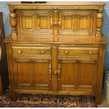A reproduction court cupboard, 125cm hig