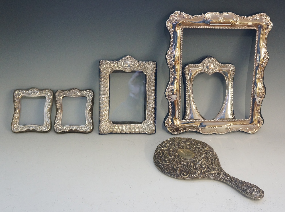 A selection of mostly silver frames, thr