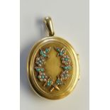 A Victorian gold coloured metal locket,