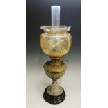An early 20th Century oil lamp, the bras