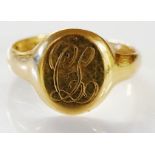 An 18ct gold signet ring, the circular c
