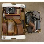 A quantity of vintage cameras and associ