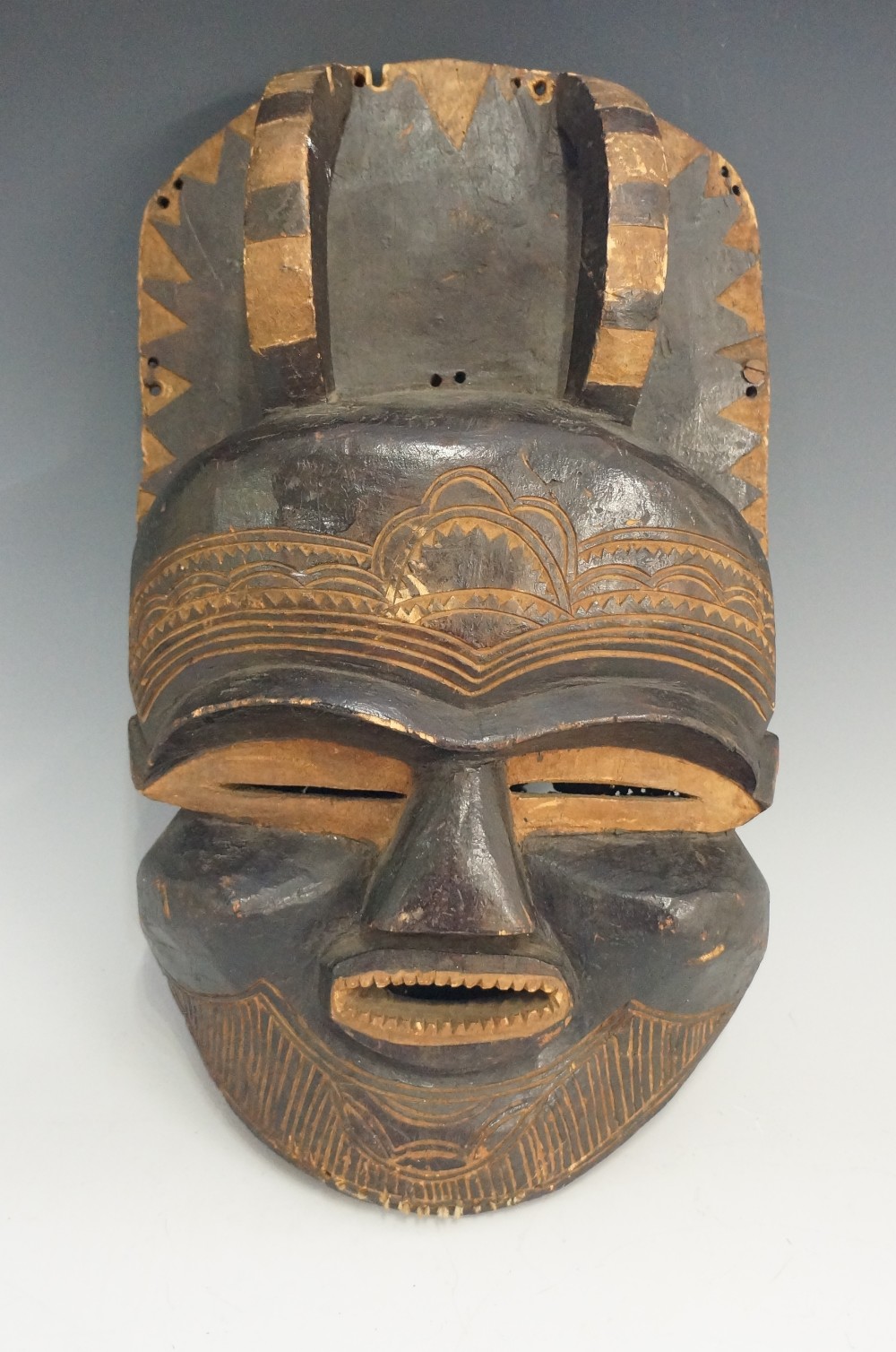 A large tribal mask, the oval face carve