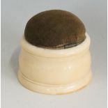 A pin cushion, the ivory body carved ivo