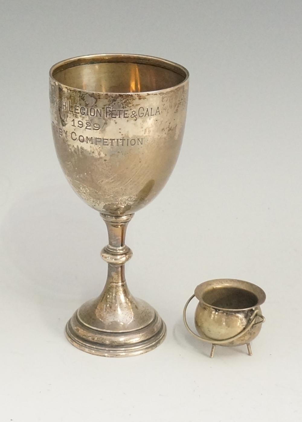 A silver goblet of conventional form, th