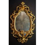 A Victorian giltwood wall mirror in the