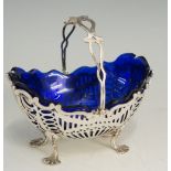 A silver basket, the oval body with pier