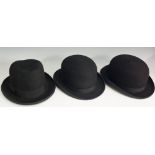 A selection of three hats, one bowler by