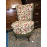 A low 1920's Tub Chair having curved back and circular seat in fawn ground fabric with raised