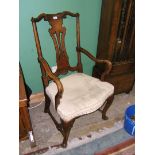 An elegant Queen Anne Walnut elbow Chair having carved and moulded top rail,
